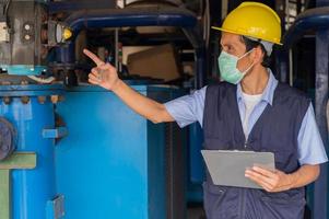 Engineers monitor the operation of industrial machinery and control systems. photo