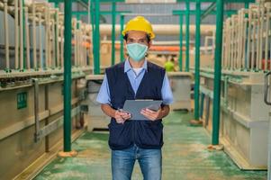 Engineers monitor the operation of industrial machinery and control systems. photo