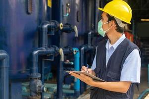 Engineers monitor the operation of industrial machinery and control systems. photo