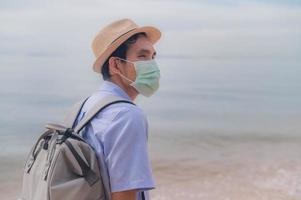 Asian man with bag travel phuket beach Thailand , Phuket sandbox photo