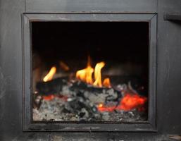 wooden stove and fire photo