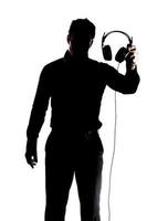 Male in silhouette showing headphones photo