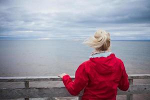 Looking at the Ocean on a cold Autumn Cloudy Day photo