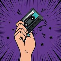 hand with cassette music pop art style icon vector