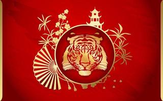 Tiger with gold on the background of a Chinese pagoda, bamboo, sakura and a fan. Happy Chinese New Year 2022. Year 2022 symbol with text.