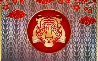 Tiger with gold on the background of a Chinese pagoda, bamboo, sakura and a fan. Happy Chinese New Year 2022. Year 2022 symbol with text.