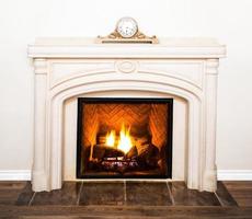 Luxurious White Marble Fireplace and empty wall photo