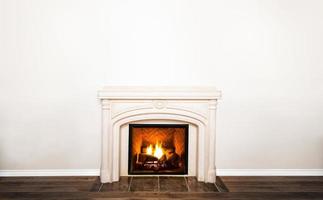 Luxurious White Marble Fireplace and empty wall photo