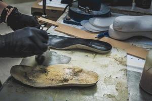 Adjusting an Orthotics Sole by Adding a Piece under the Arch photo