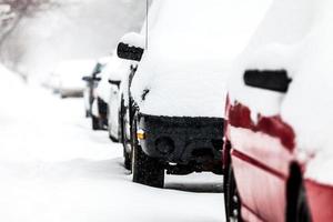 Parked Cars on a Snowstorm Winter Day photo