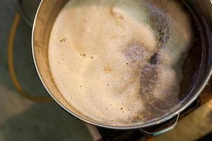 Froth of Home-Brew Mash in a Stock Pot photo