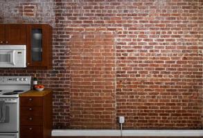 Industrial Old Flat Brick Wall Perspective in a kitchen. photo