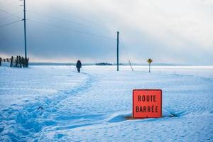 Closed Road and Unrecognizable Person Walking in Background photo