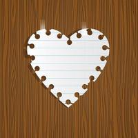 corazón de papel en madera vector