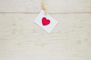 envelope with heart hanging rope photo