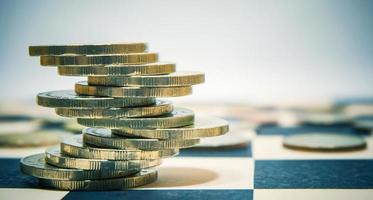 Euro coins stacked on checkers table for economy or investment concept. photo