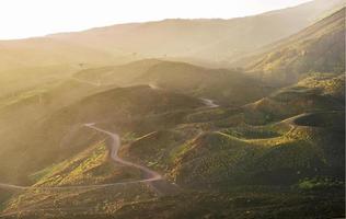 Fog at sunset over the volcano Etna photo