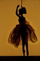 Darkened ballerina figure photo