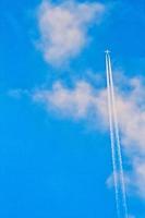 Plane Flying with Trails photo