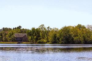 Hidden house on lake photo