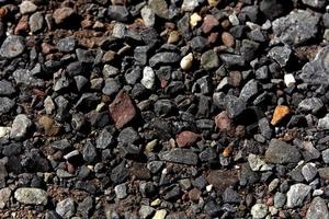 Various pebbles on ground photo