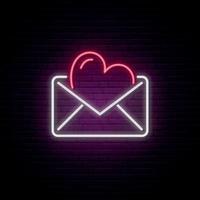 Glowing neon envelope with a heart. vector