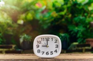 clock is placed on the table showing the time of life. photo