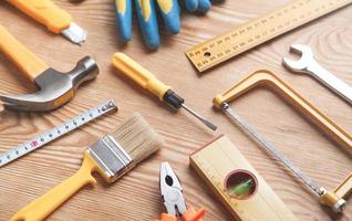 Work tools on wooden background. photo
