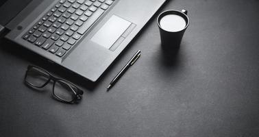 Business objects on black desk. photo