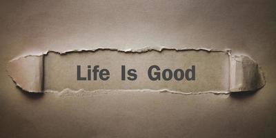 Text Life Is Good on torn paper. photo