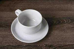 Cup of coffee on a wooden brown photo