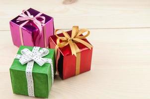 Gift boxes on a wooden floor photo