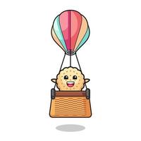 round biscuits mascot riding a hot air balloon vector