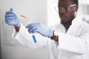 Experiments in the chemical laboratory. An experiment was carried out in a laboratory in transparent flasks photo