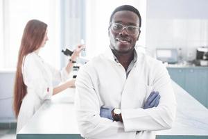 Laboratory laboratories conduct experiments in a chemical laboratory in transparent flasks. Output formulas photo