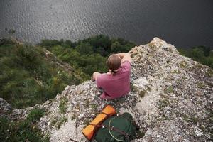 Attractive man enjoying the view of the mountains landscape above the water surface. Travel Lifestyle adventure vacations concept photo