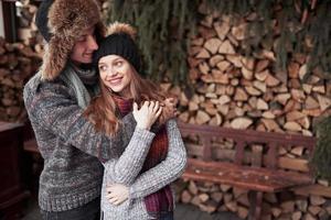 Happy Young Couple in Winter Park having fun.Family Outdoors. photo