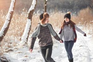 Happy Young Couple in Winter Park having fun.Family Outdoors photo