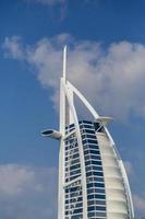 DUBAI, UAE, JANUARY 16, 2014 - View of hotel Burj al Arab in Dubai. At 321 m, it is the fourth tallest hotel in the world and has 202 rooms. photo