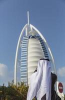 DUBAI, UAE, JANUARY 16, 2014 - View of hotel Burj al Arab in Dubai. At 321 m, it is the fourth tallest hotel in the world and has 202 rooms. photo