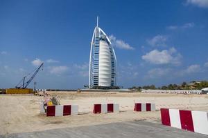 DUBAI, UAE, JANUARY 16, 2014 - View of hotel Burj al Arab in Dubai. At 321 m, it is the fourth tallest hotel in the world and has 202 rooms. photo