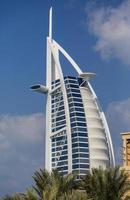 DUBAI, UAE, JANUARY 16, 2014 - View of hotel Burj al Arab in Dubai. At 321 m, it is the fourth tallest hotel in the world and has 202 rooms. photo