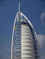 DUBAI, UAE, JANUARY 16, 2014 - View of hotel Burj al Arab in Dubai. At 321 m, it is the fourth tallest hotel in the world and has 202 rooms. photo