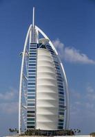 DUBAI, UAE, JANUARY 16, 2014 - View of hotel Burj al Arab in Dubai. At 321 m, it is the fourth tallest hotel in the world and has 202 rooms. photo