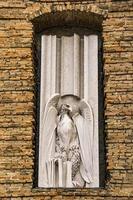 Eagle, symbol of John the Evangelist, on the facade of  Abbey of St Justina in Padua, Italy. photo