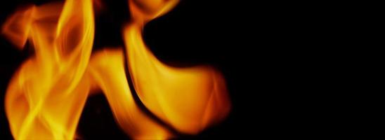 Fire background. Abstract burning flame and black background. photo