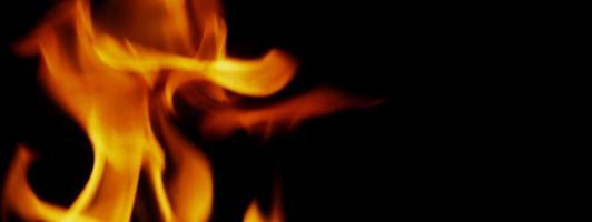 Fire background. Abstract burning flame and black background. photo