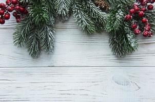 Christmas Fir Tree On A Wooden Background photo
