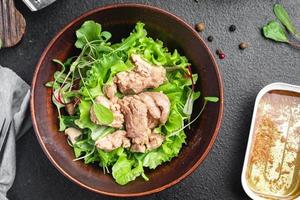 Cod liver salad seafood mix lettuce leaves