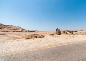 old buses without wheels in the desert in Egypt photo